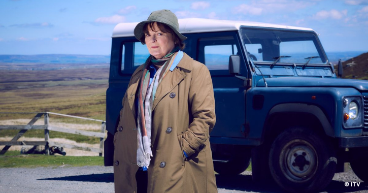 Actress Brenda Blethyn stood in front of Land Rover car dressed as Vera.